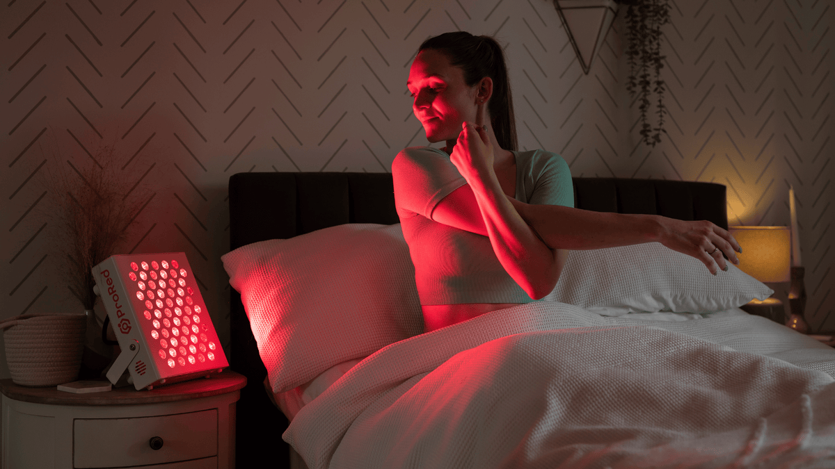 Girl stretching while doing red light therapy